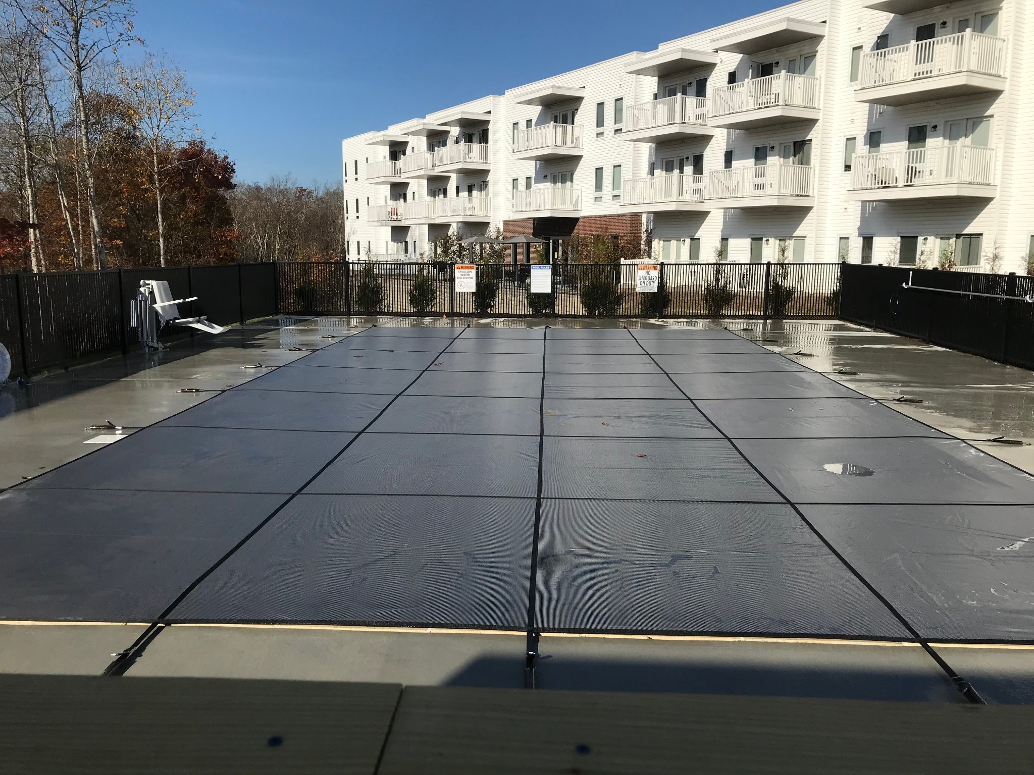 Safety cover installed on residential pool